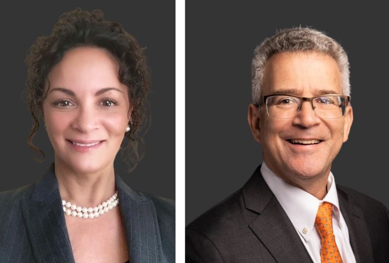 headshots of a woman and man in front of a grey background